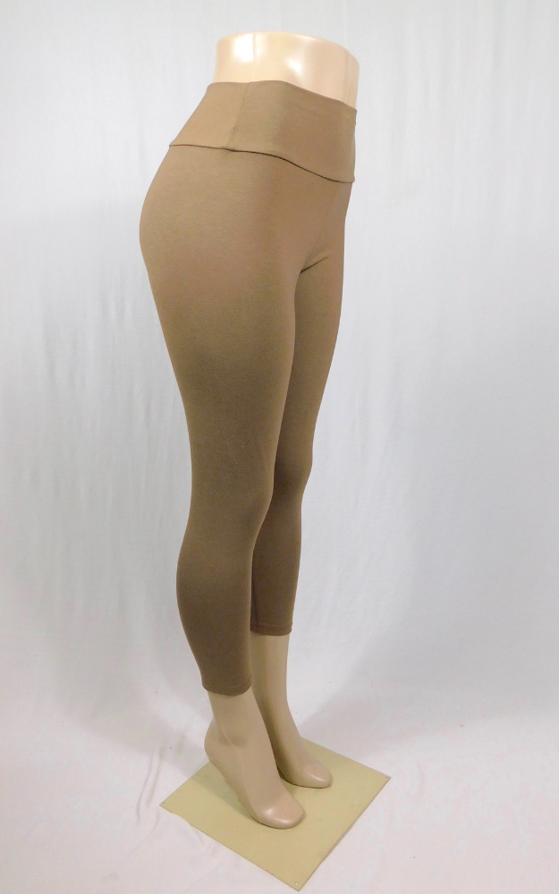 Bamboo capri leggings with a comfortable large waistband displayed on a mannequin. The tights are beige in color and have a 23-inch inseam.