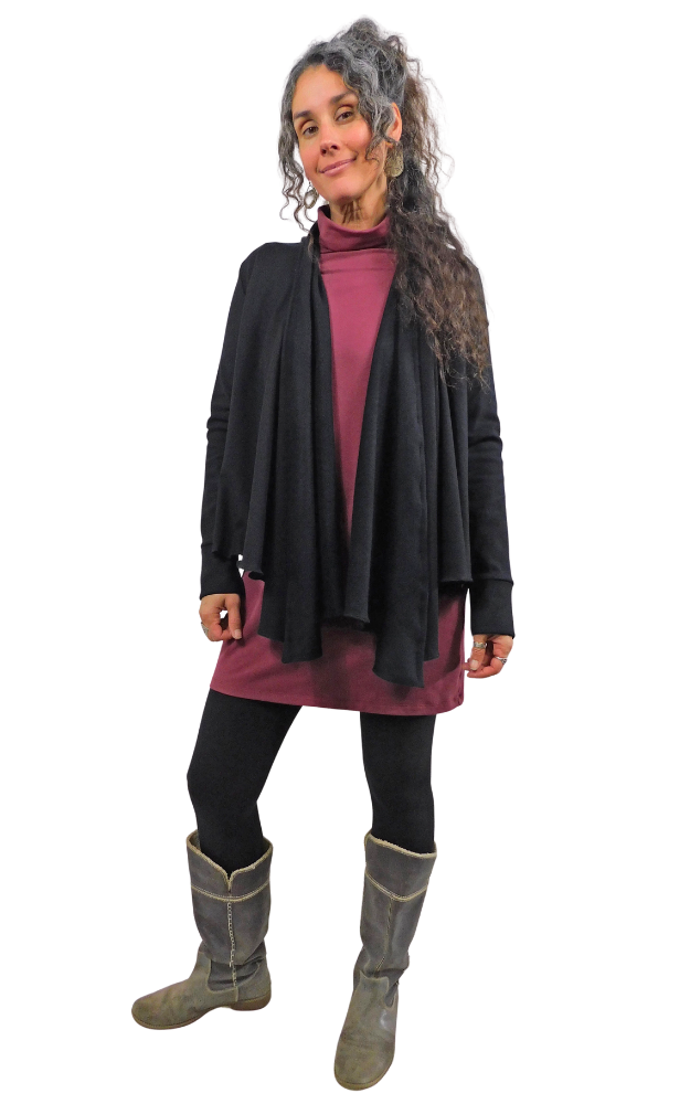 Woman wearing a black cardigan, wine coloured dress, and gray boots on a white background