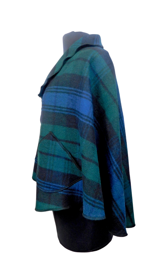 Plaid cape on a mannequin against a white background