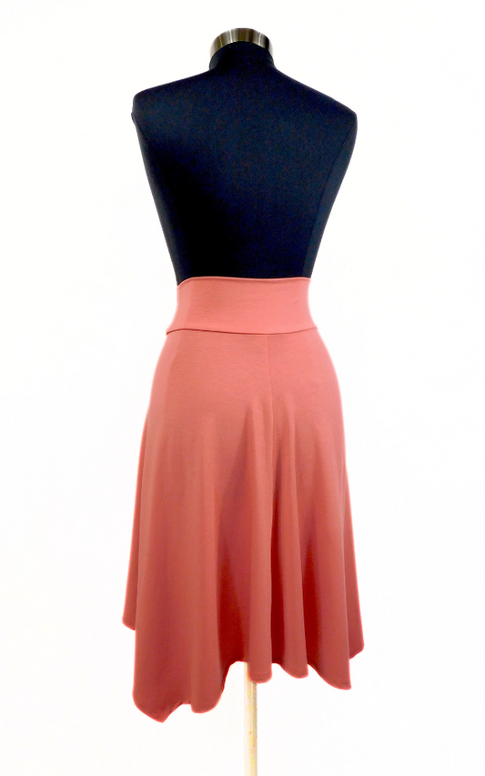 Back view of peach coloured flared knee length skirt  worn on black dress dummy