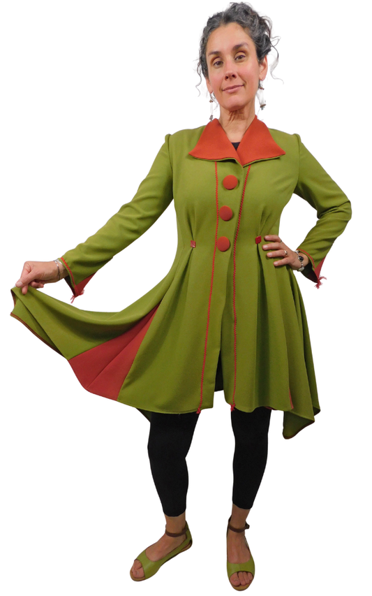 Woman wearing green coat with red trim and buttons on a white background