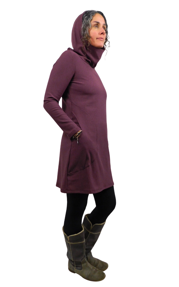 Person wearing a long wine-coloured hoodie with a hood on a white background