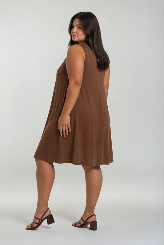 Woman wearing a brown sleeveless dress on a white background