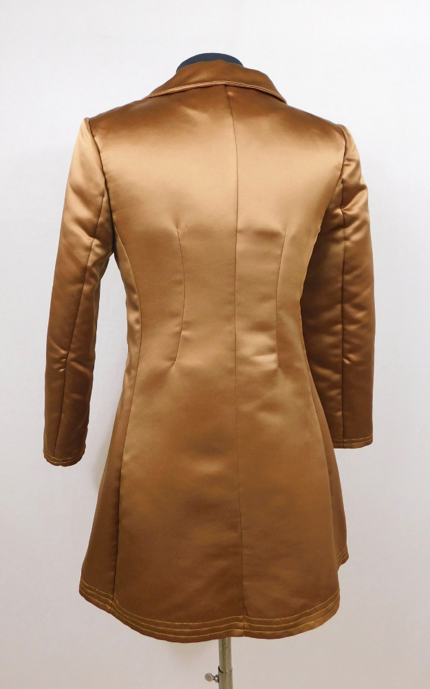 Brown coat on a mannequin against a white background