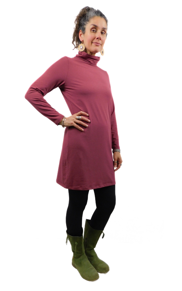 Wine long sleeve turtle neck dress, black tights and green boots worn on woman