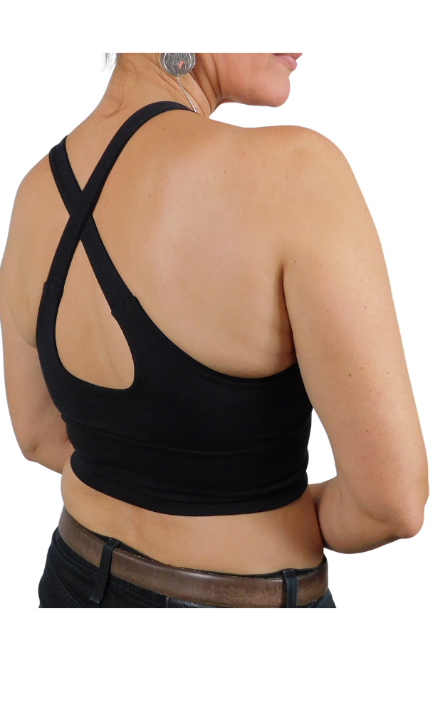 Black sports bra worn by a person on a white background