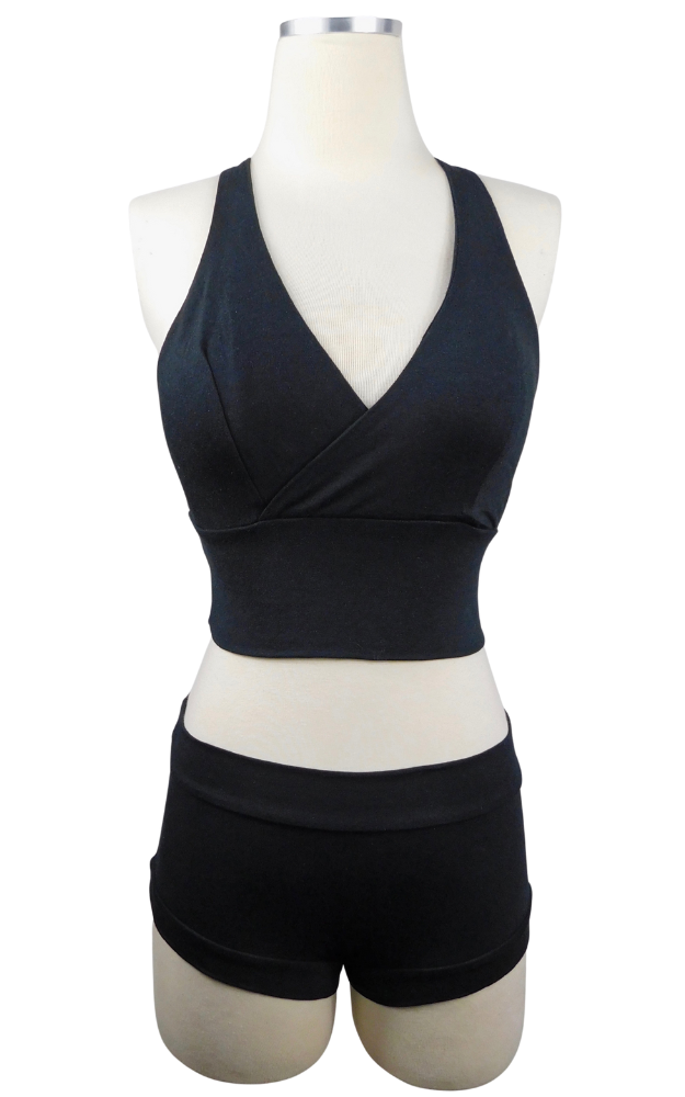 Black bra top and shorts on a mannequin against a white background