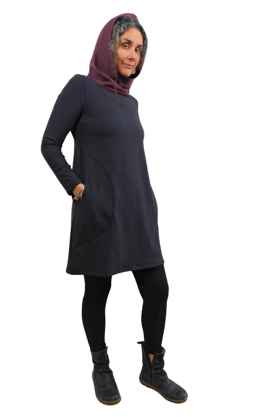 Person wearing a black hooded dress with a maroon hood on a white background