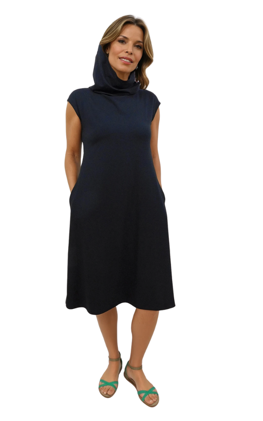 Woman wearing a black dress with a hood on a white background