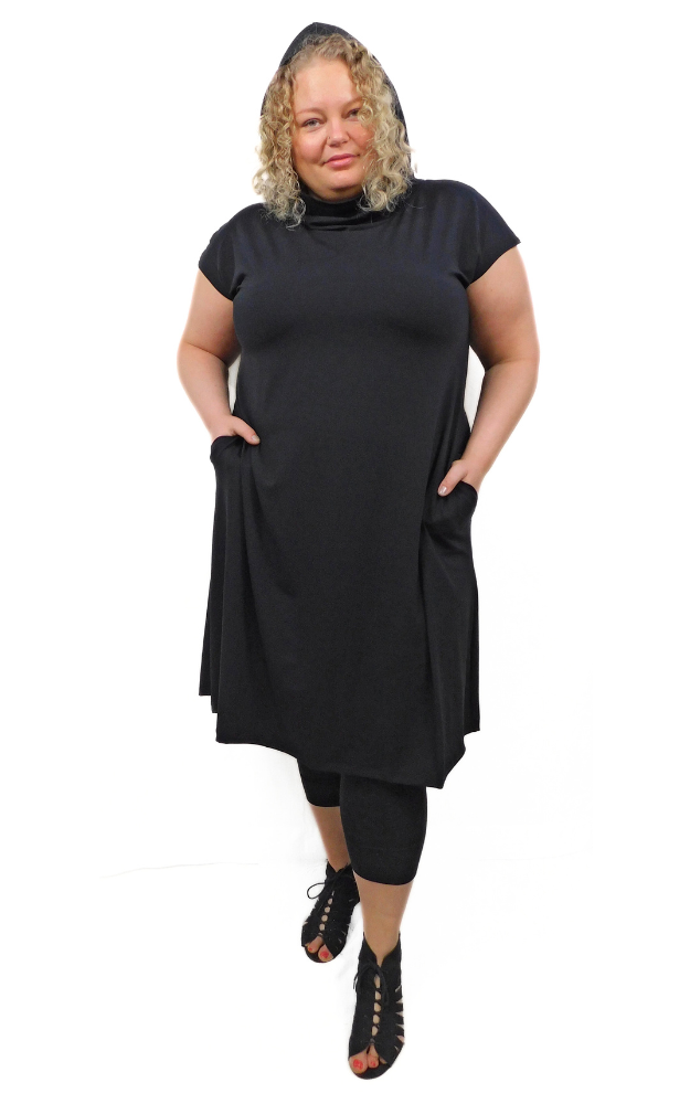 Size 3XL Model wearing hood up Black capped sleeve wide long tunic dress with side pockets and large hood that can drape around the neck as a cowl. Garment is made from a 
High Twist Jersey knit w/Spandex, with a lovely stretch and drape. 