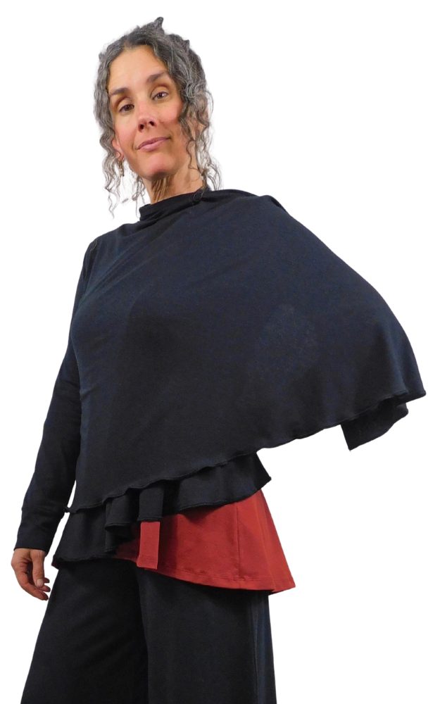 Person wearing a black wrap sweater garment with a red top showing underneath on a white background