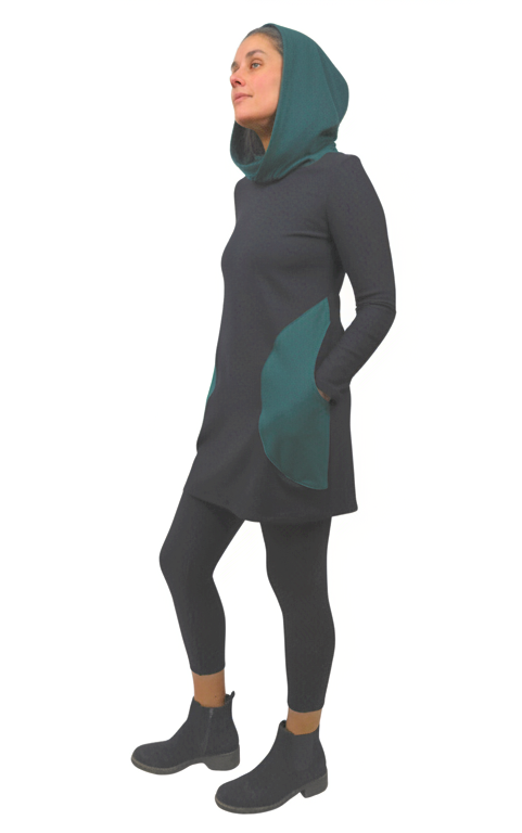 Person wearing a dusky black and pine green hooded dress with leggings on a white background