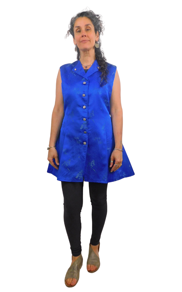 Woman wearing a blue sleeveless dress on a white background