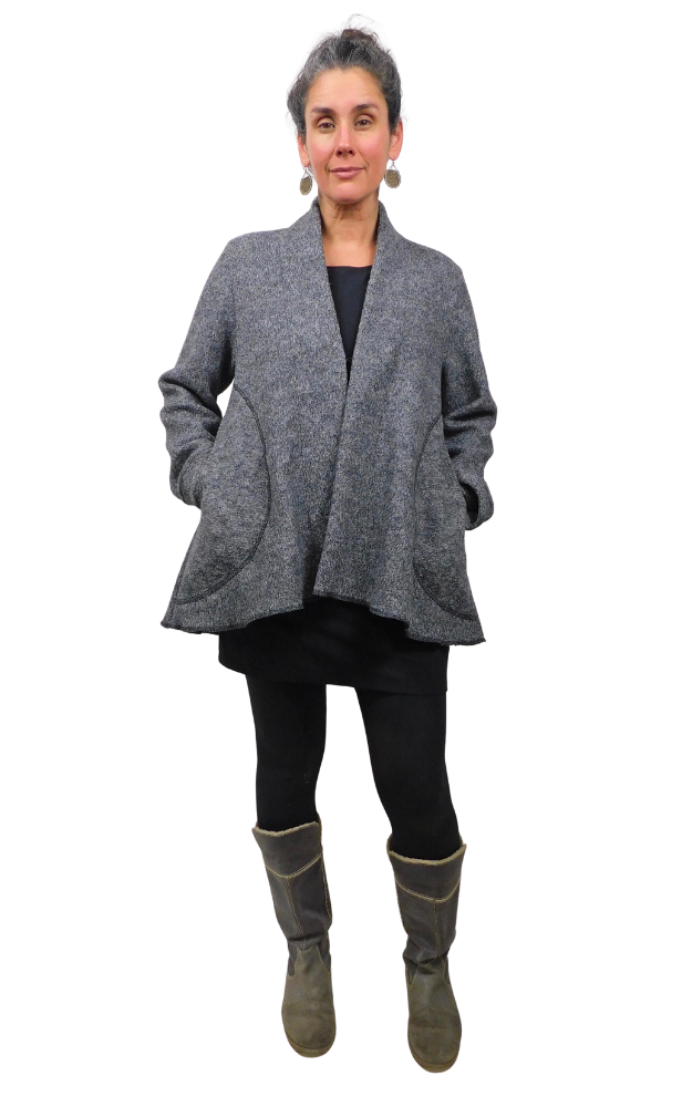 Woman wearing charcoal wool coat and black tights and grey boots