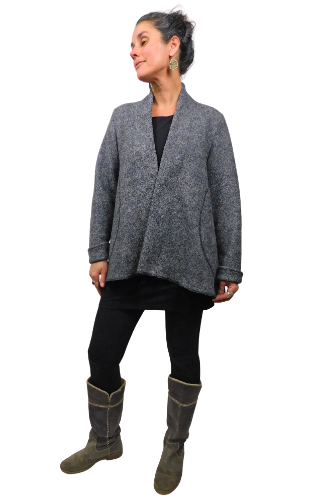 Woman wearing charcoal wool coat, black tights and grey boots