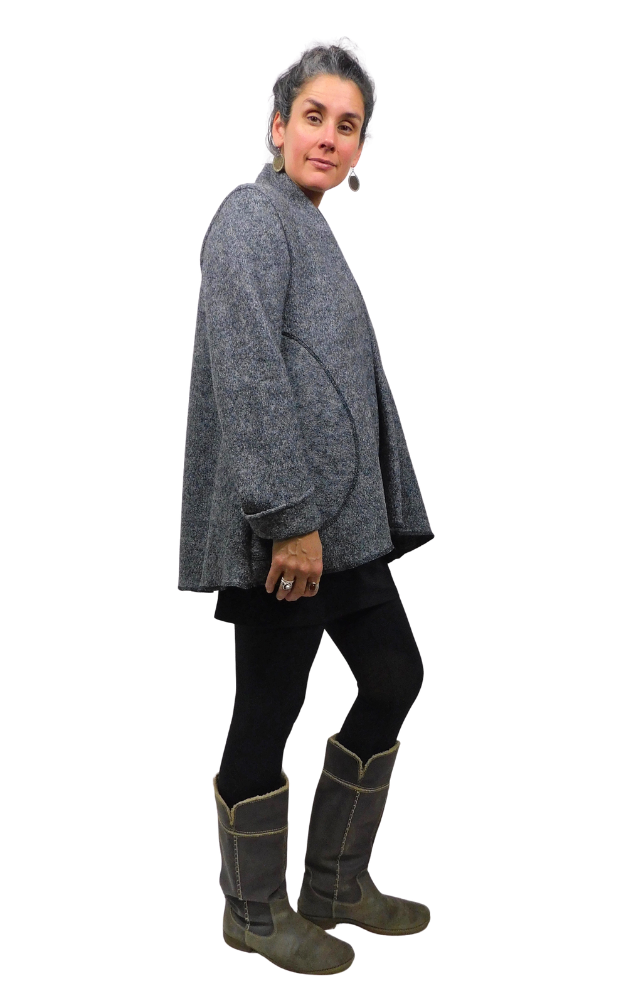 Side view of woman wearing charcoal wool coat and black tights and grey boots