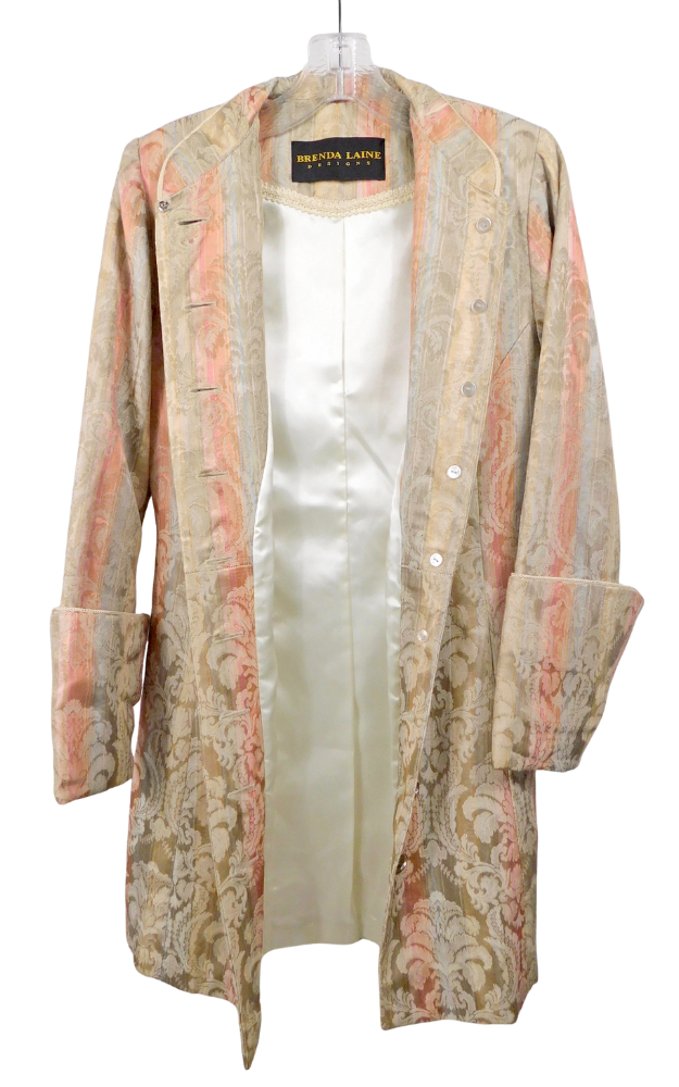 A patterned coat hanging open to show lining