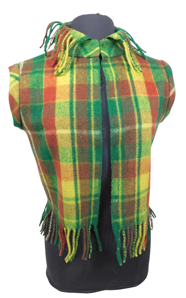 A green, yellow, and orange tartan plaid fringed vest displayed on a black mannequin torso against a white background.