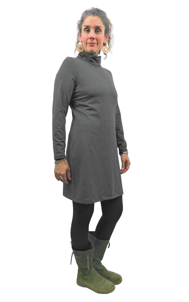 Woman wearing a gray turtleneck dress on a white background