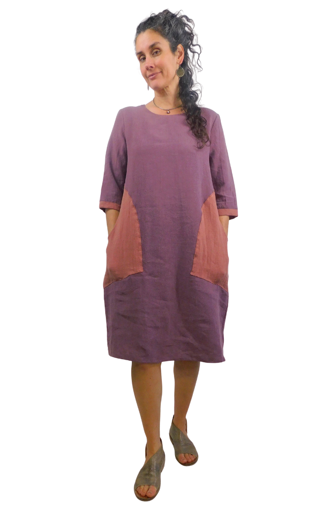 Woman wearing a two-tone dress with a white background