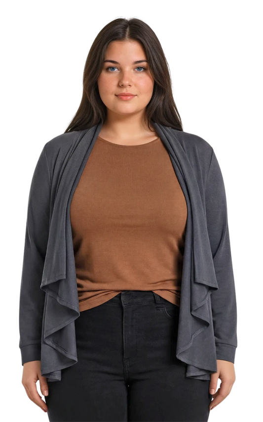 Woman wearing a gray cardigan over a brown top and black pants on a white background