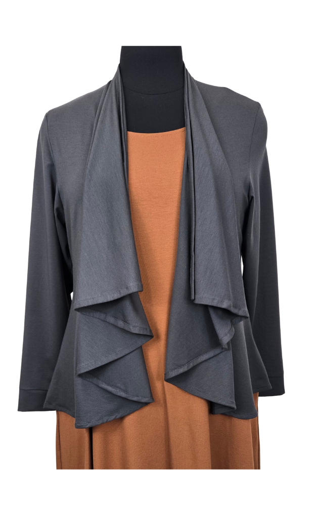 Gray layered cardigan over a brown dress on a mannequin against a white background