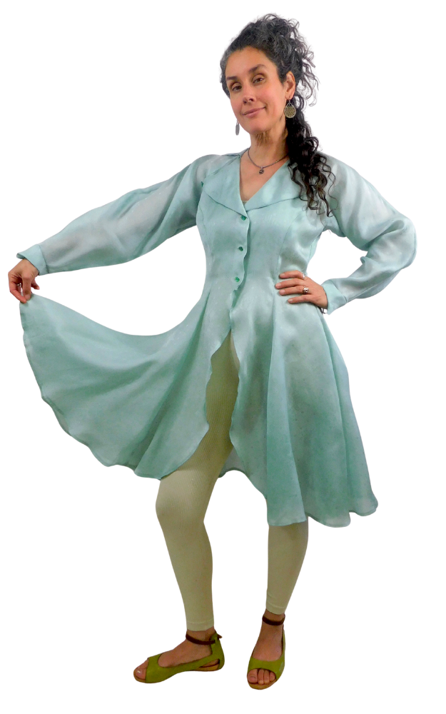 Woman wearing a light green dress with a white background