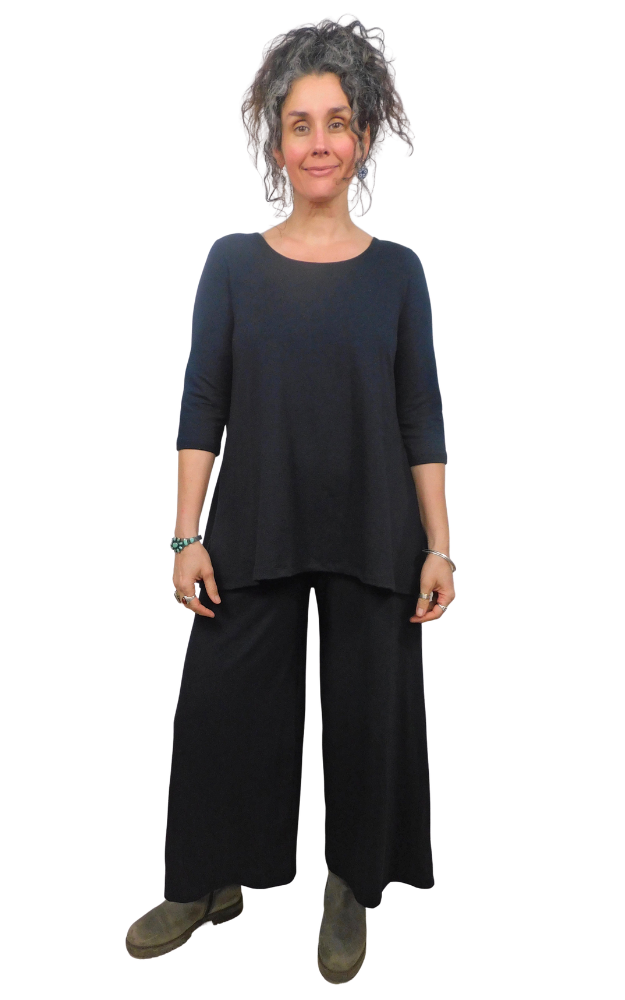 Woman wearing a black outfit on a white background