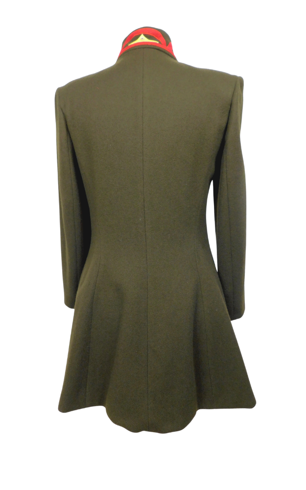Green coat back on a mannequin with a white background
