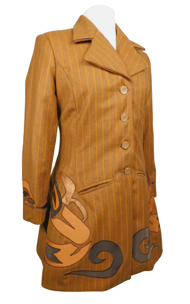 Striped golden brown coat with native art design on skirt and cuff 