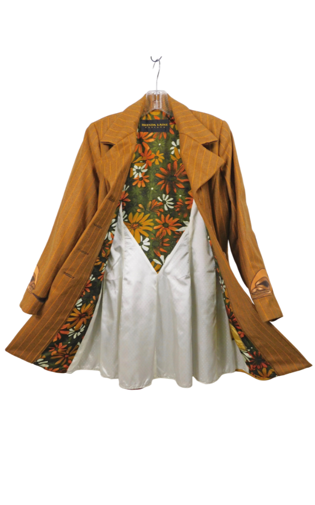 Golden brown striped coat with floral patterned lining on a hanger