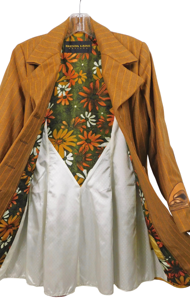 Striped golden brown coat with floral patterned lining on a hanger