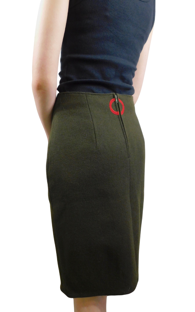 Green skirt back with a red circular decoration at waist on a white background
