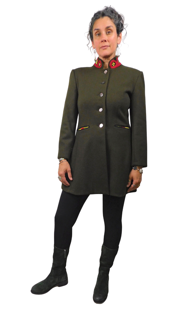 Person wearing a green coat with buttons on a white background