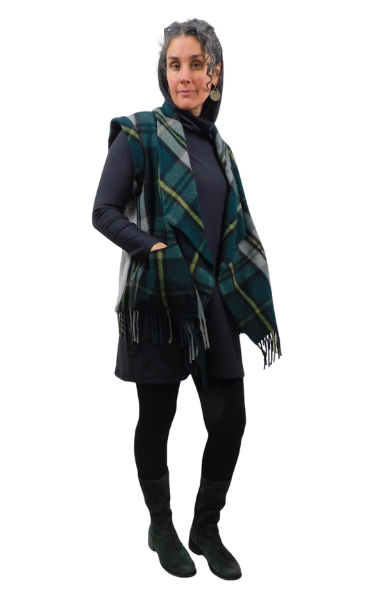 Woman wearing a plaid vest on a white background