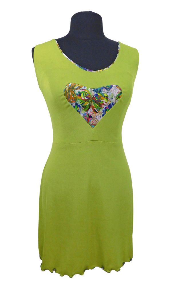 Green dress with a colorful heart-shaped patch on a mannequin against a white background