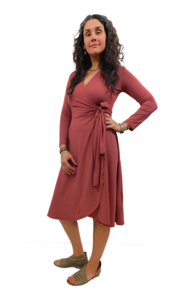 Woman wearing wine coloured wrap dress, long sleeve with long side ties