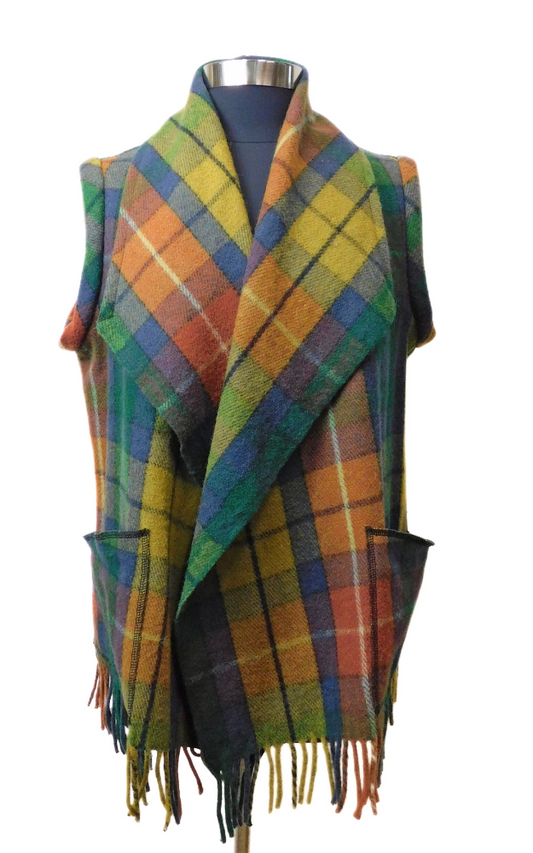 Colorful plaid vest with fringes on a mannequin against a white background