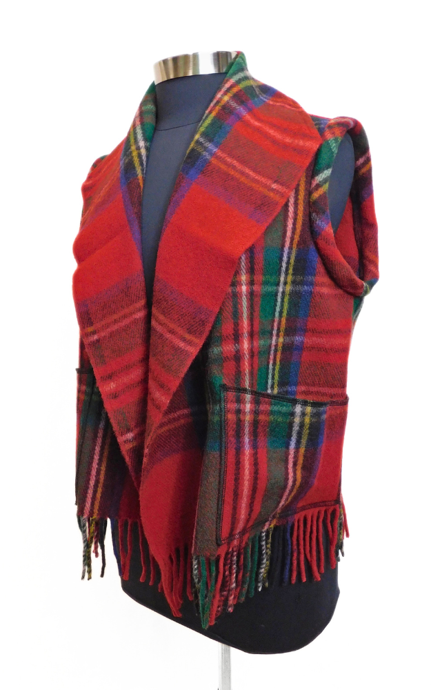 Red Tartan vest draped over a mannequin on a white background