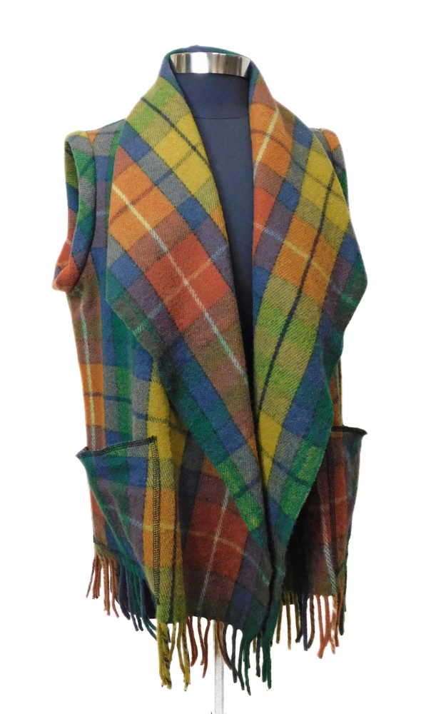 Colorful plaid tartan vest with fringes on   a white background