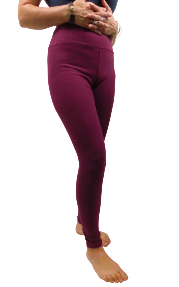 A person wearing high-waisted leggings in a deep burgundy wine color, shown from the waist down against a plain white background.
