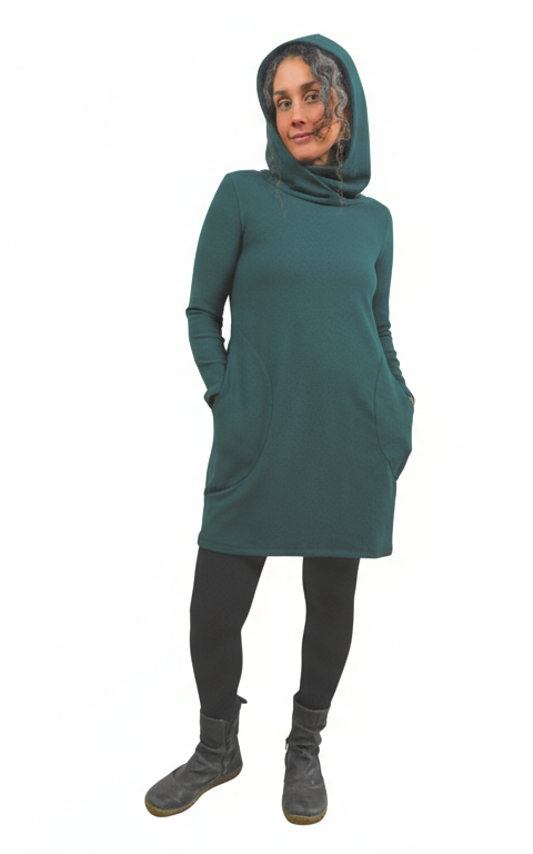 Person wearing a pine green dress with a hood on a white background