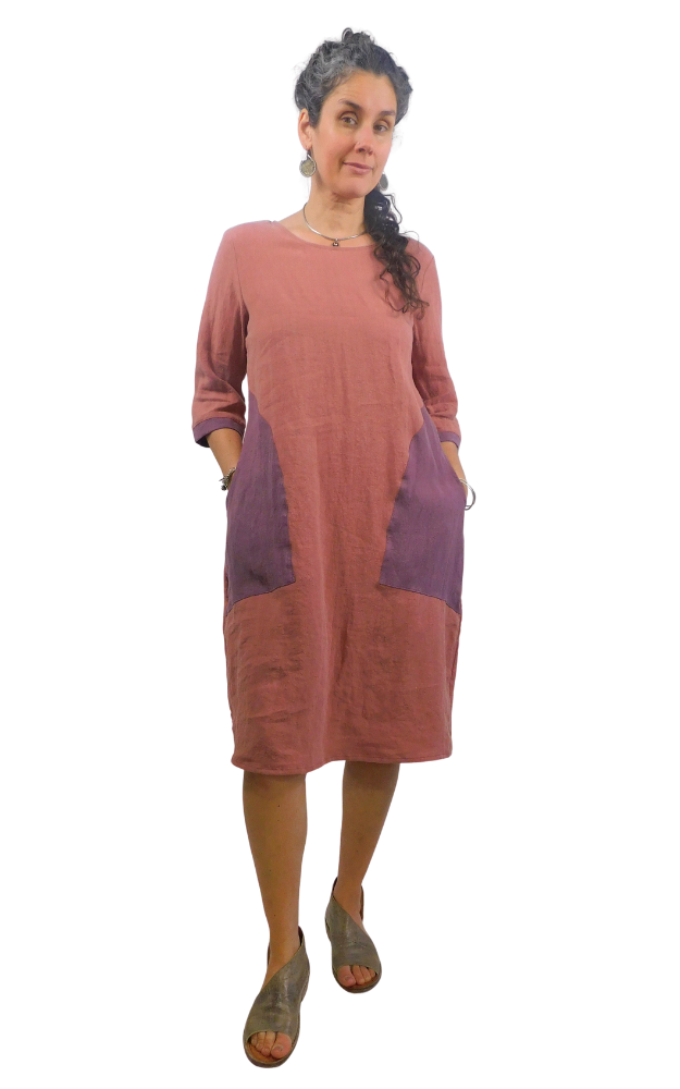 Woman wearing a two-tone dress with a white background