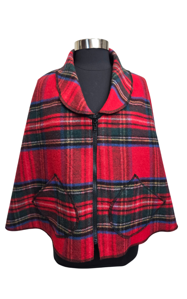 Red and black plaid cape on a mannequin against a white background
