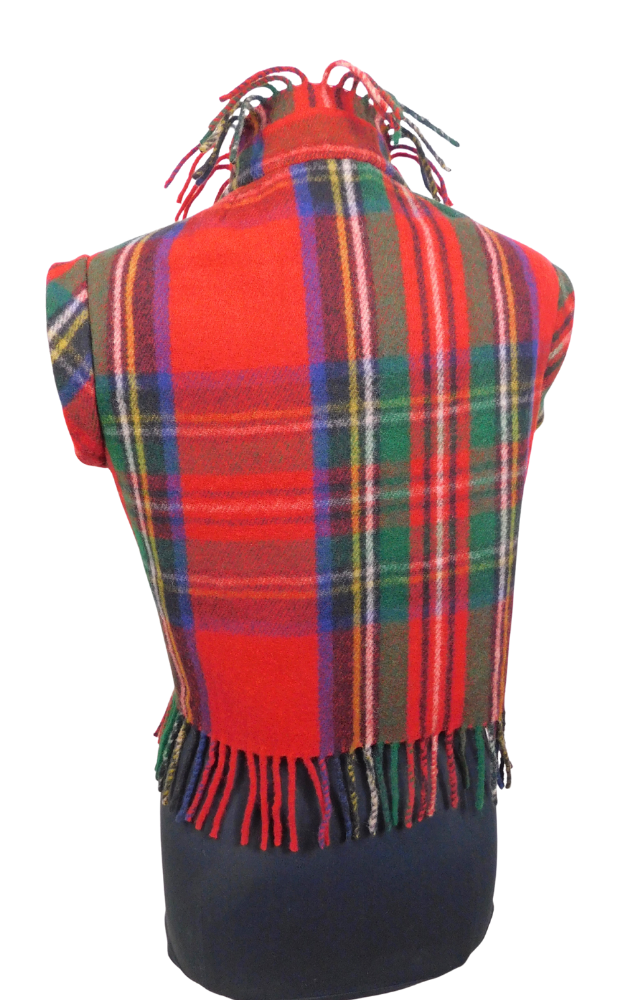A red tartan plaid fringed vest back view draped on a black dress form against a white background.