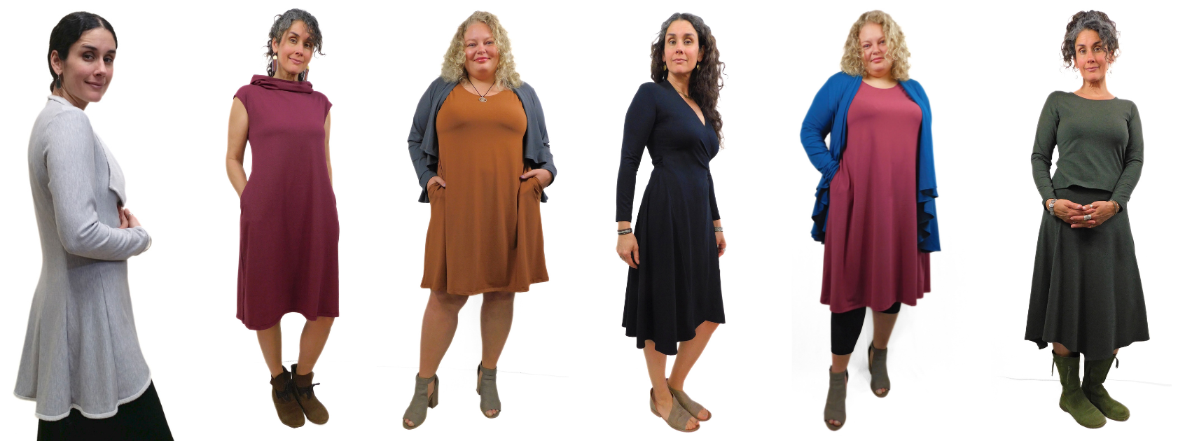 Six women, one wearing a grey fleece jacket and the others wearing variety of dresses/