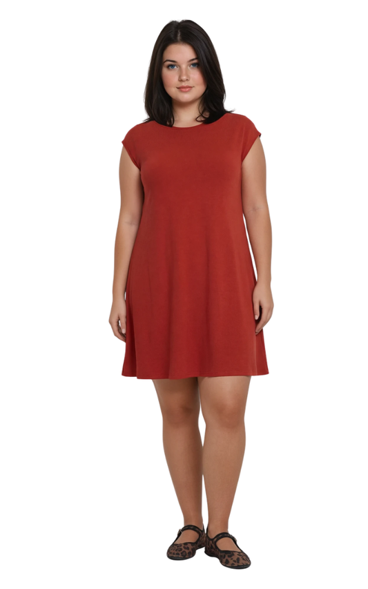 Woman wearing a rust red dress on a white background
