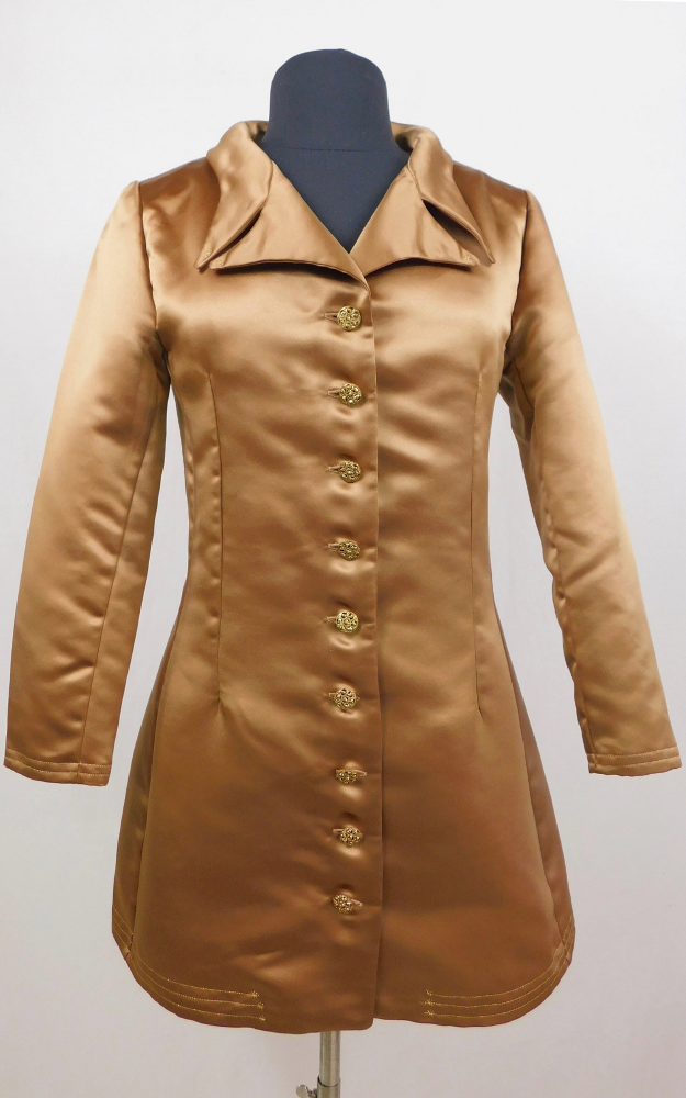 Bronze coat on a mannequin against a white background