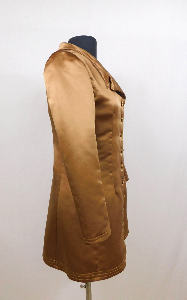 Brown jacket on a mannequin against a white background