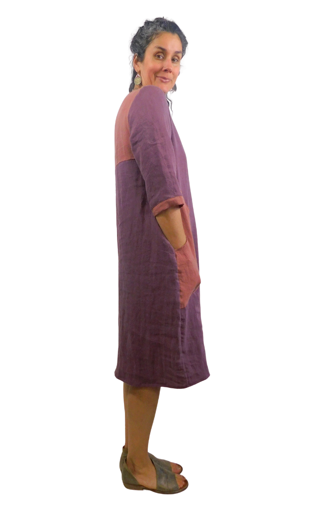 Woman wearing a two-tone dress with a white background